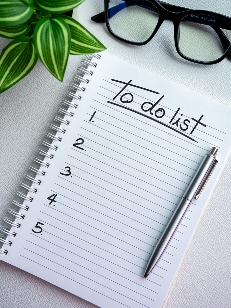 An open spiral notebook with "To Do List" at the top of the page.